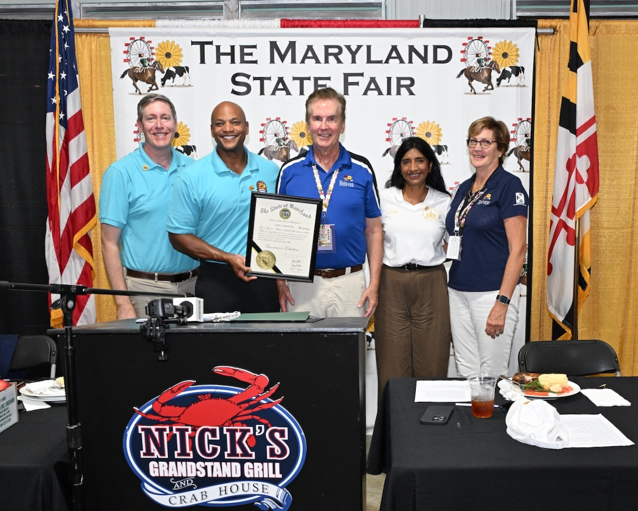 Lt Governor Miller and Governor Moore standing with three people