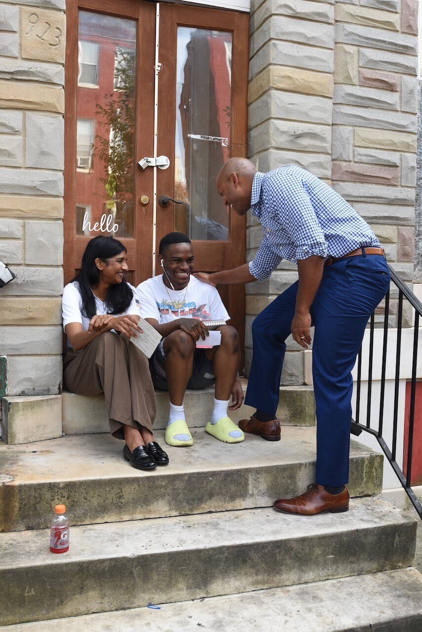 Governor Moore and Lt. Gov. Miller with person on steps