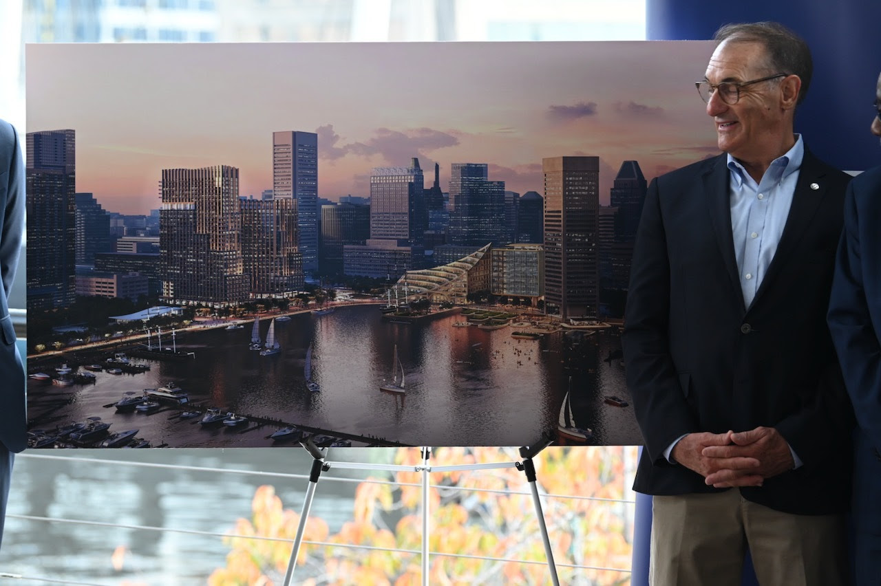 Design board shown with a photo of the future plans for the Harborplace in Baltimore City.