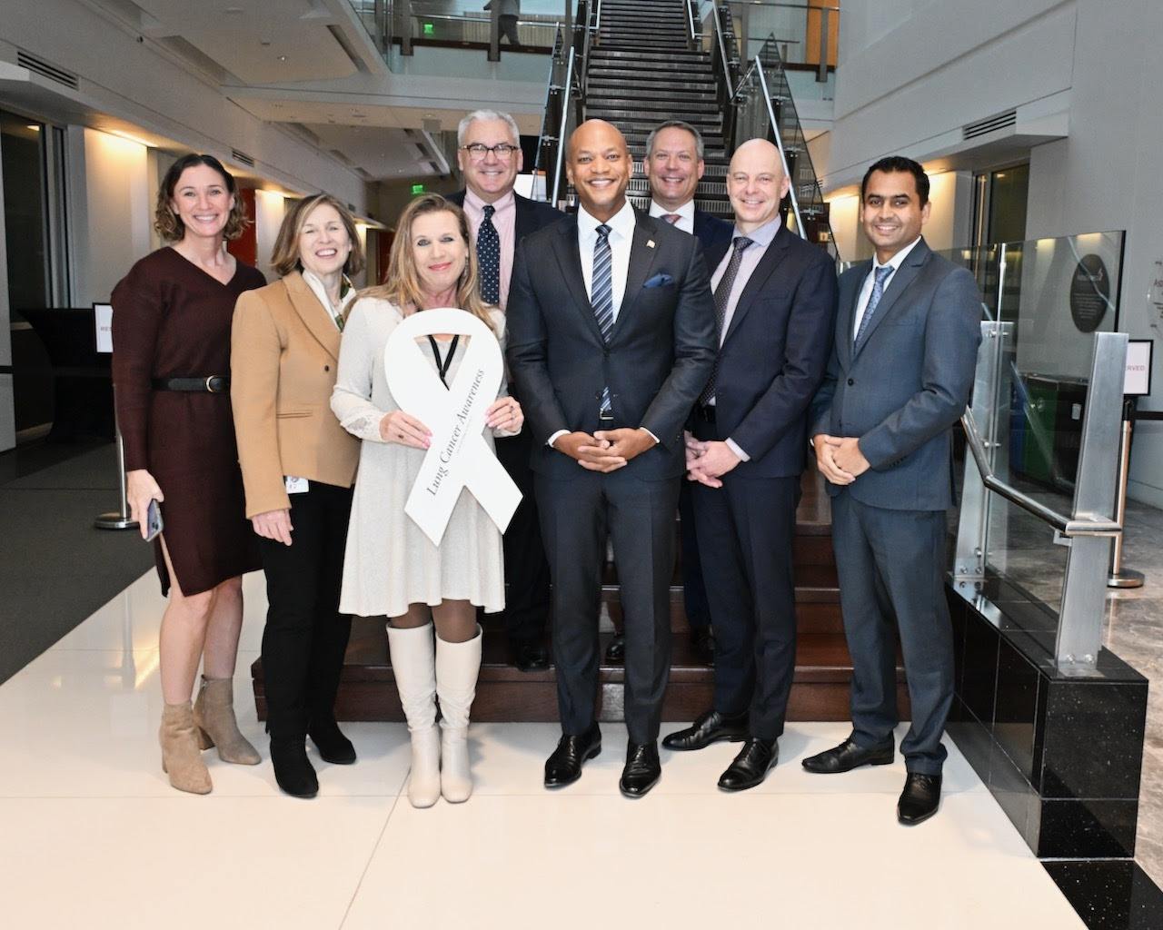 Governor Moore stands with staffers at AstraZeneca Gaithersburg.